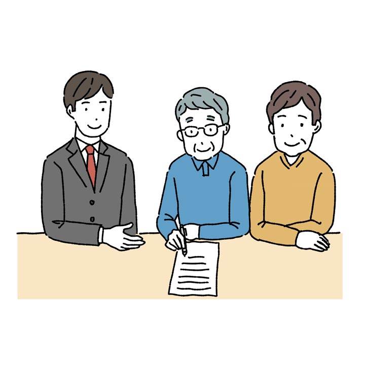 弁護士と家族が遺言を作成しているイメージ